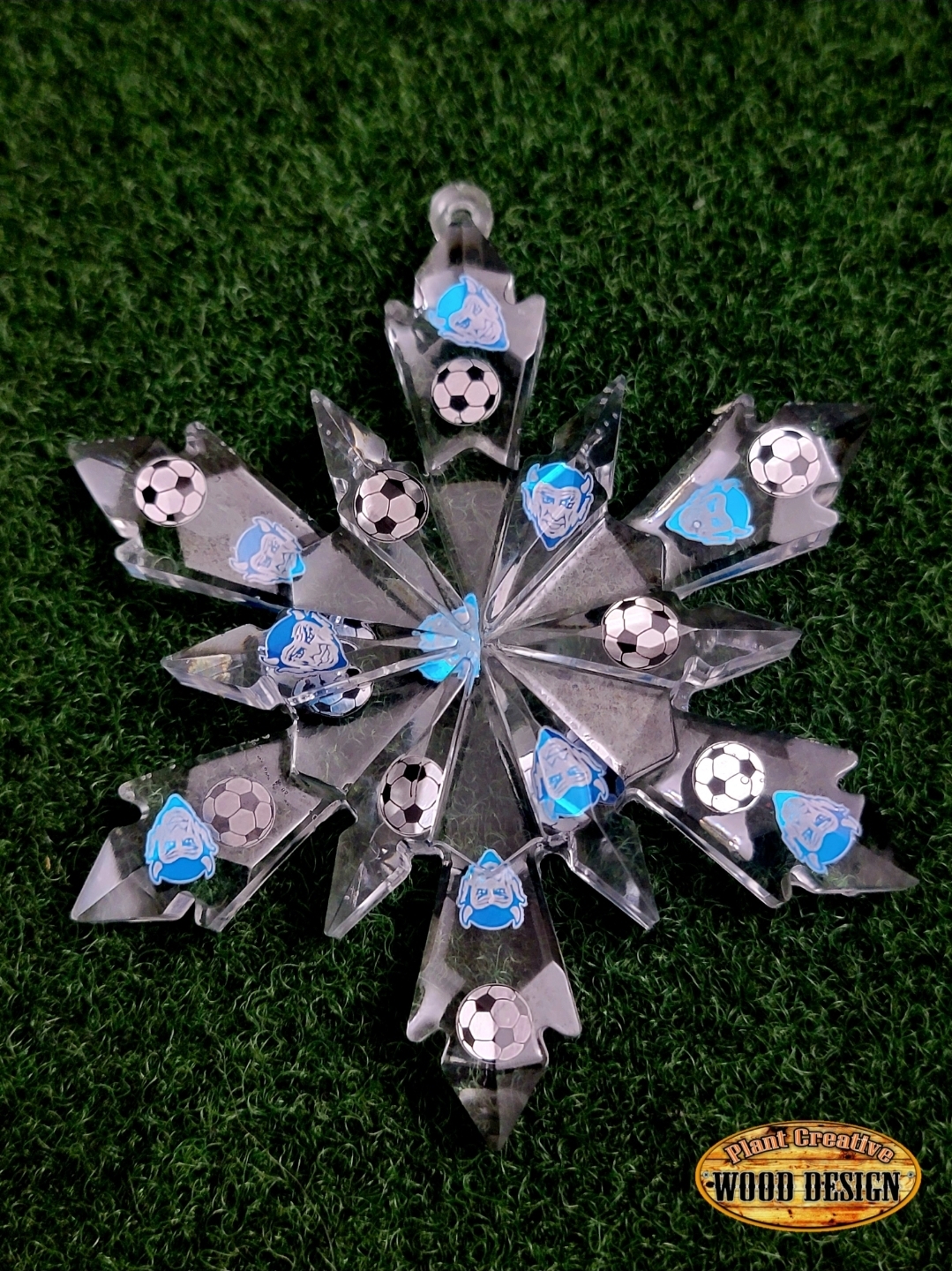 4.5" epoxy snowflakes with custom engraved/cut metal devil heads and sport ball (put into comments which one) inside of the snowflake cut from thin metal. ONE OF A KIND