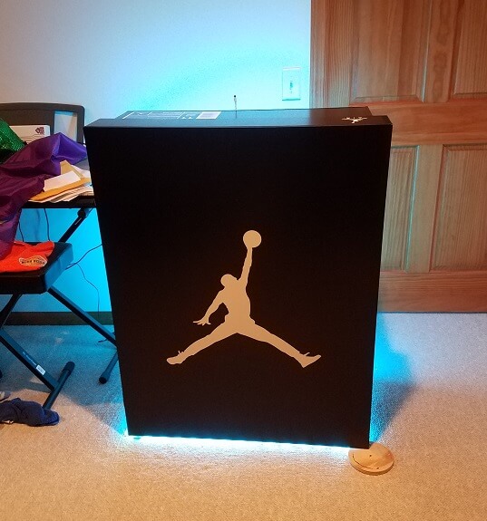 The front opens and has multiple shelves to store your shoes.  It comes with a remote that controls the lights.  Very realistic to what an actual Jordans shoebox looks like. 