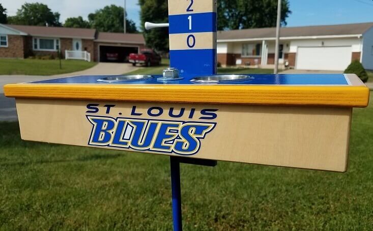 These custom-built stands are one-of-a-kind. The painted steel "stands" have a custom-built platform are made to mimic the end of Cornhole boards. The pair includes one with a scoreboard, one without, and both having removable stainless steel cup inserts.